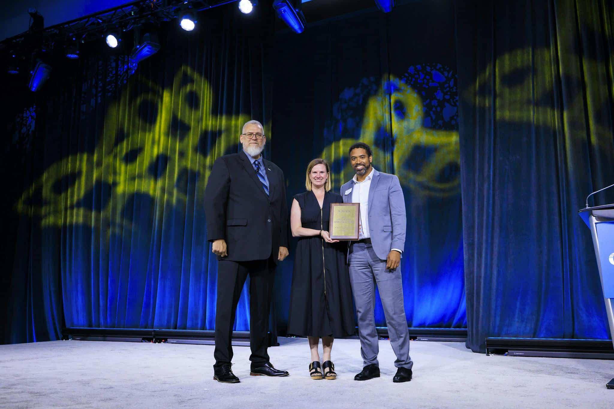 Photo of Claire Tulloch accepting CMAA Chapter Achievement Award