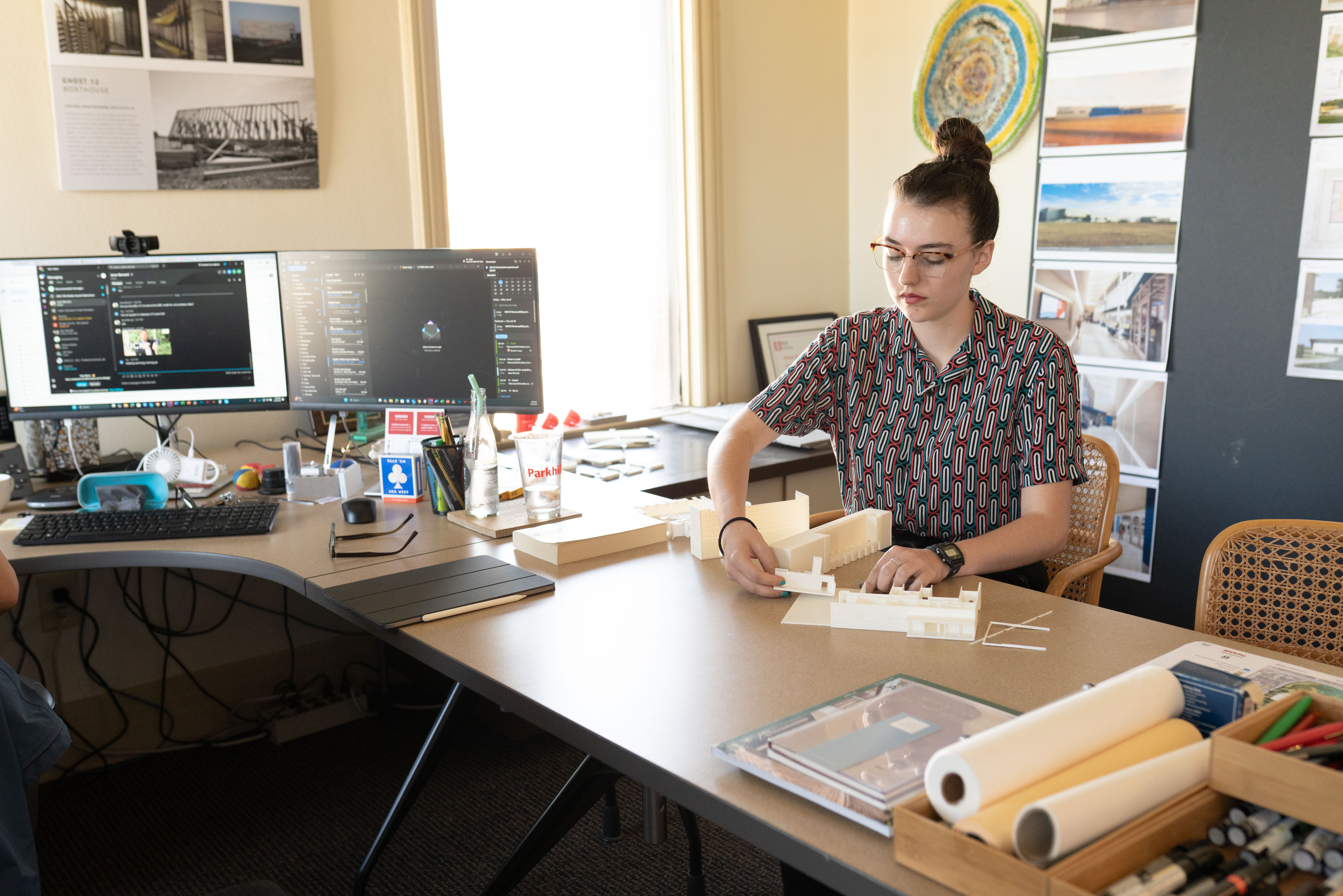 D.A. Crowell, high school student intern, working on a model at her desk.