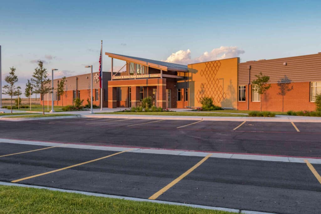 Front view of Frank Phillips College Dalhart Campus, featuring the building and its surrounding parking area.