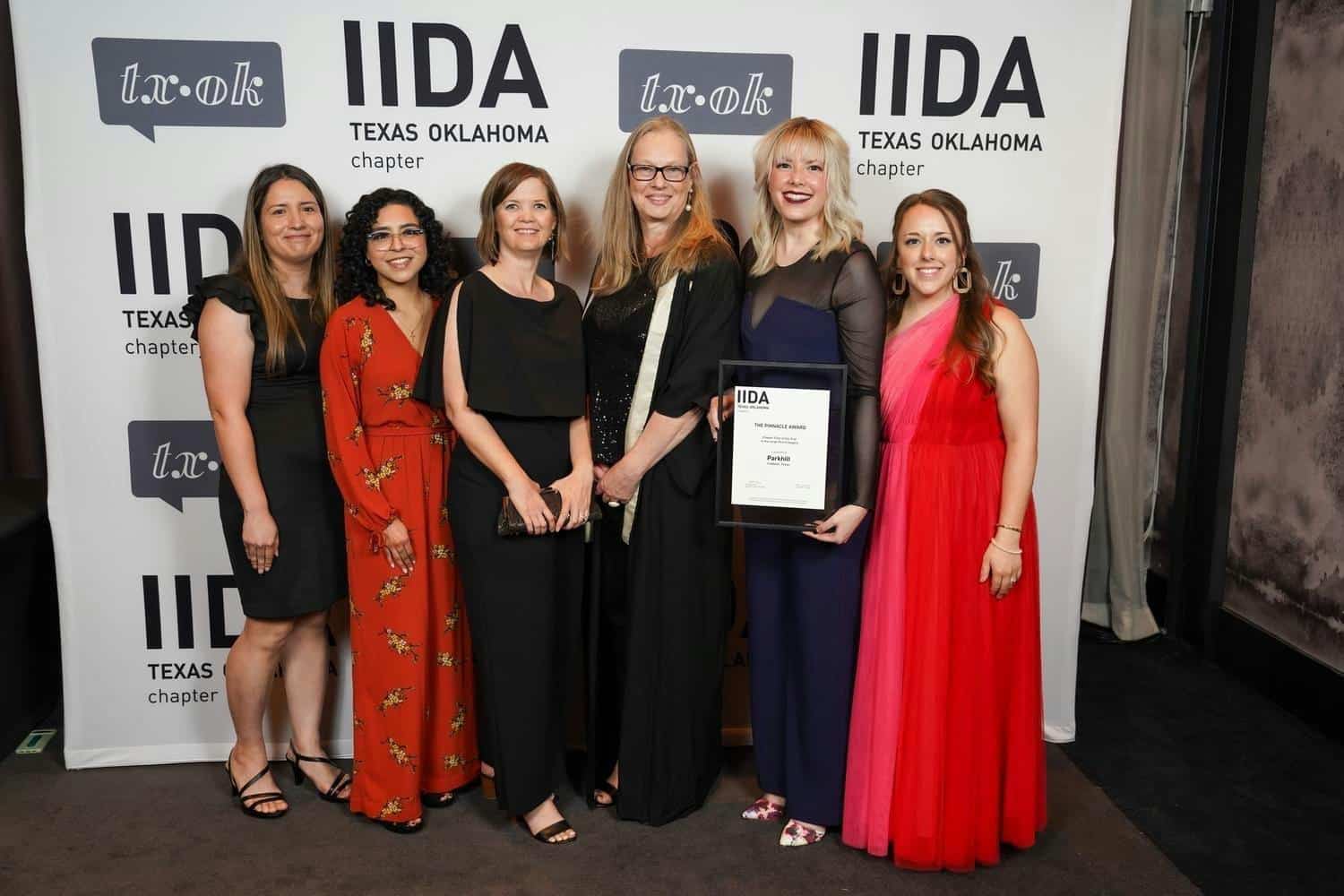 Photo of Parkhill Interiors team after receiving IIDA Texas-Oklahoma Chapter's Pinnacle and Best in City Center Awards for 2024