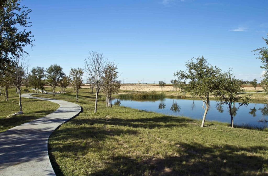Photo of Payne Villas of Woodland Park community in Midland, Texas, features man-made ponds and a jogging trail