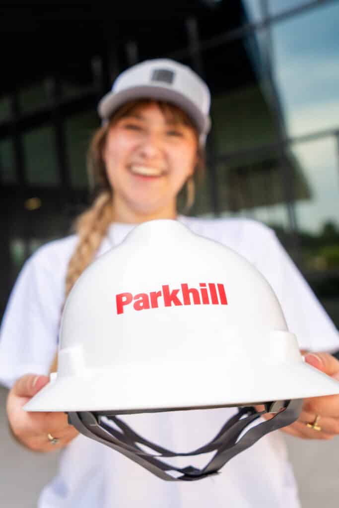 Student holding a hard hat