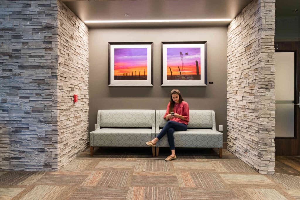 Woman sitting in bench space