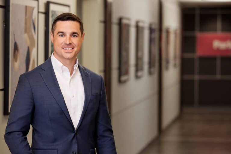 headshot of Sam Wyatt in a hallway