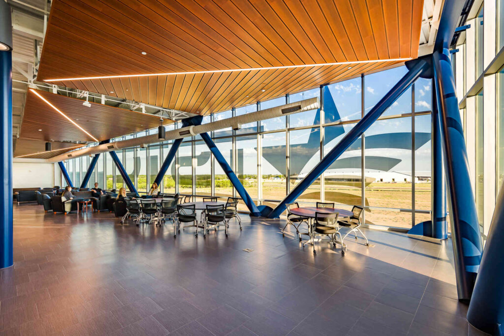 Interior of Texas State Technical College Abilene Industrial Tech with modern design, large windows, and seating area.