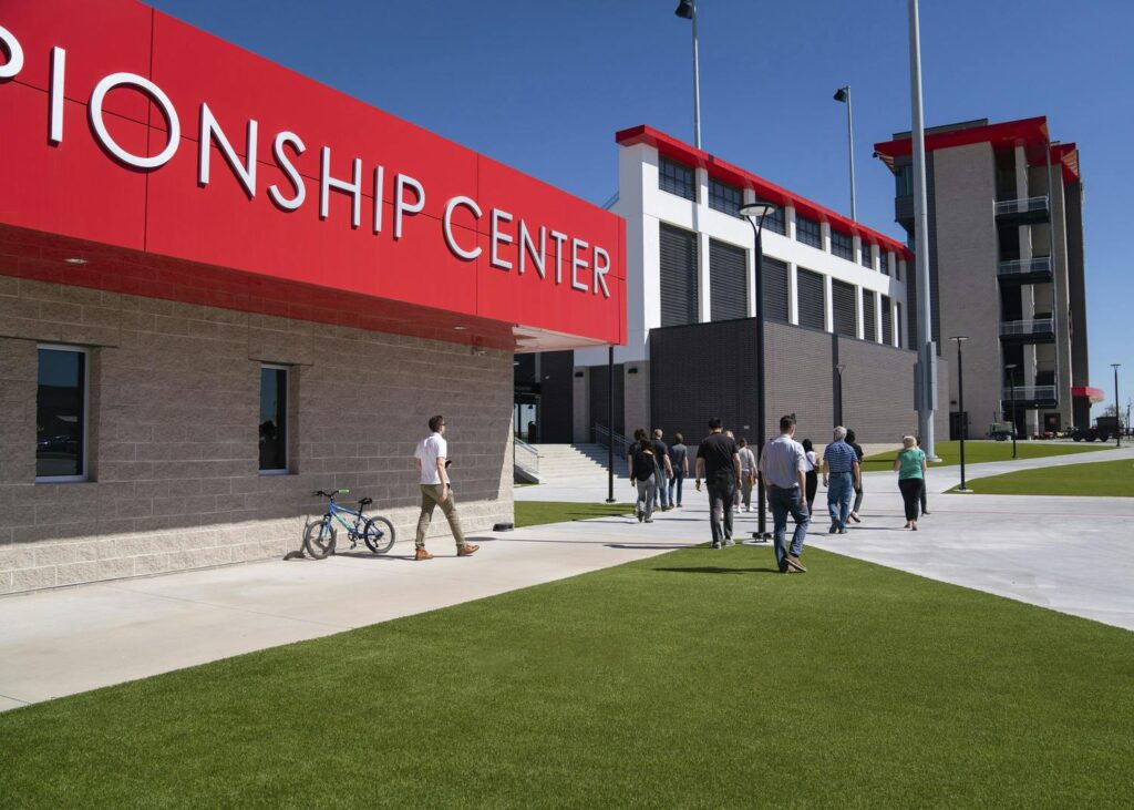 people walking outside of Melissa Championship Center